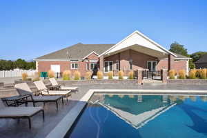 View of swimming pool with a patio area