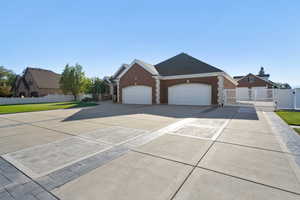 View of front of home with a garage and a front yard