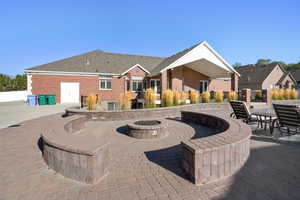 View of patio / terrace featuring an outdoor fire pit