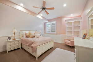 Bedroom with dark colored carpet and ceiling fan