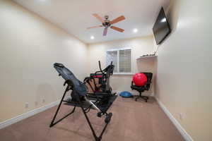 Bedroom or Workout area with carpet and ceiling fan