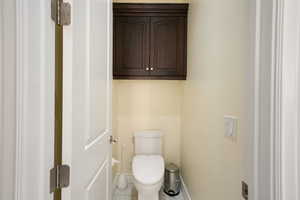 Primary Bathroom Bidet toilet closet with tile patterned flooring and toilet