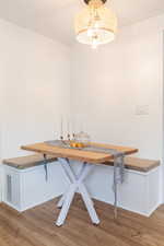 Unfurnished dining area with wood-type flooring and breakfast area