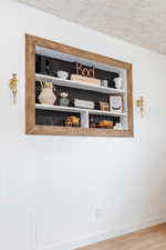 Interior details featuring hardwood / wood-style flooring