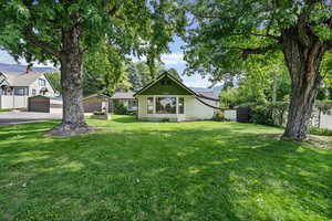 Exterior space featuring a front yard and a garage