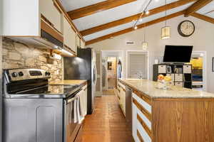 Kitchen featuring decorative light fixtures, light stone countertops, beam ceiling, an island with sink, and stainless steel appliances