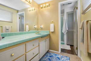 Bathroom with hardwood / wood-style floors and vanity