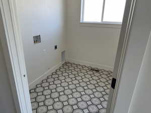 Laundry area featuring electric dryer hookup and washer hookup