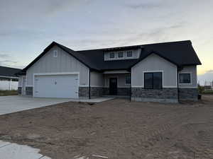 View of front facade featuring a garage