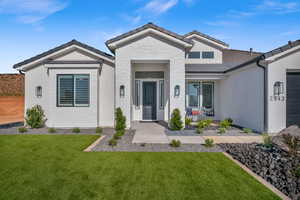 View of front of home featuring a front lawn