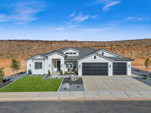 Ranch-style house with a garage and a front yard