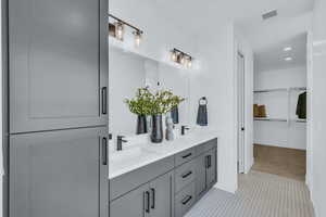 Bathroom with vanity and tile patterned flooring