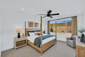 Bedroom featuring ceiling fan and carpet flooring