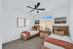 Bedroom with ceiling fan and carpet flooring