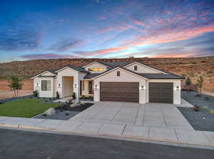 View of front facade featuring a mountain view and a garage