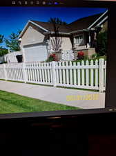 View of front of home featuring a garage