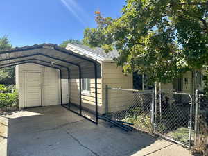 View of vehicle parking with a carport