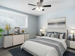 Bedroom featuring dark carpet and ceiling fan