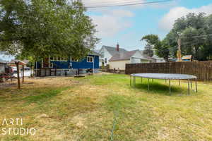 View of yard with a trampoline