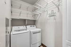 Washroom with washing machine and clothes dryer