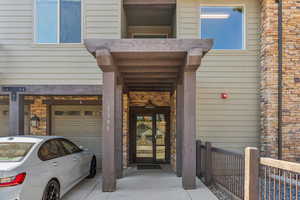 Property entrance featuring a garage