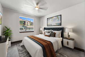 Carpeted bedroom featuring ceiling fan