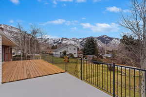 Exterior space with a mountain view and a yard