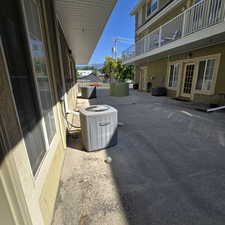 View of patio / terrace featuring a balcony and central AC unit