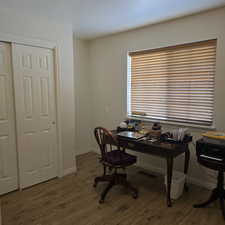 Home office featuring wood-type flooring