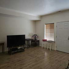 Miscellaneous room with a textured ceiling, dark hardwood / wood-style floors, and ornamental molding