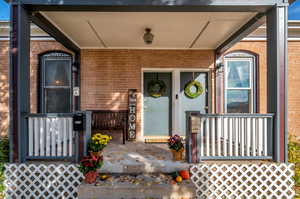 Entrance to property with a porch