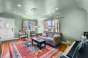 Living room featuring dark hardwood / wood-style flooring