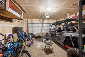 Garage featuring a garage door opener