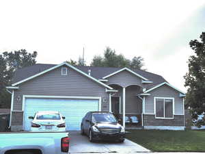 Single story home featuring a garage