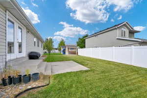 View of yard with a patio