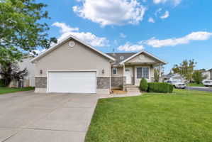 View of front of home with exrea wide garage