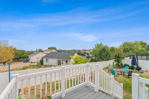 Wooden deck featuring a fire pit