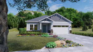 View of front of home with a garage and a front lawn