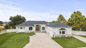 View of front of house with a front yard