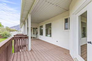 Wooden deck featuring a mountain view