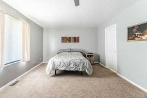 Bedroom featuring carpet floors and ceiling fan