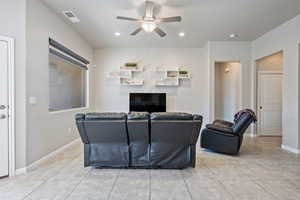 Tiled living room with ceiling fan