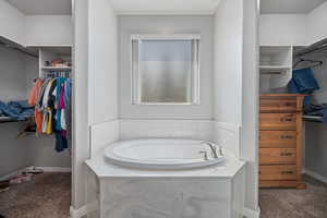 Bathroom with a tub to relax in