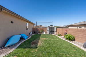 View of yard featuring a storage shed