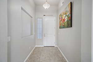 Interior space featuring light tile patterned flooring