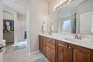 Bathroom featuring vanity and tile patterned flooring