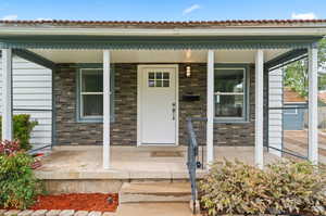 Property entrance featuring covered porch