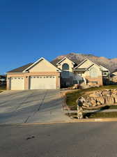 Ranch-style home with a mountain view and a garage