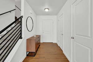 Corridor with light wood-type flooring