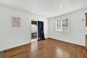 Empty room featuring hardwood / wood-style flooring